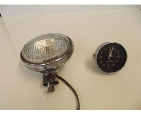 Lucas car lamp together with a vintage Volvo clock 