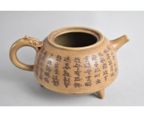 A Chinese Earthenware Teapot with Stylised Handle, Squat Body with Calligraphy Inscription Raised on Tripod Supports, Seal Ma