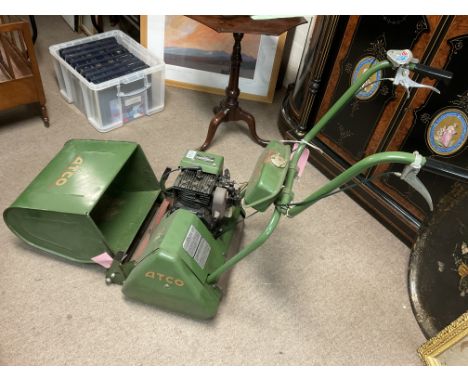 A vintage Atco De-Luxe fourteen petrol lawn mower.