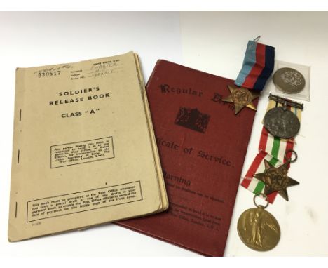 A collection of first and Second World War medals and army documentation.