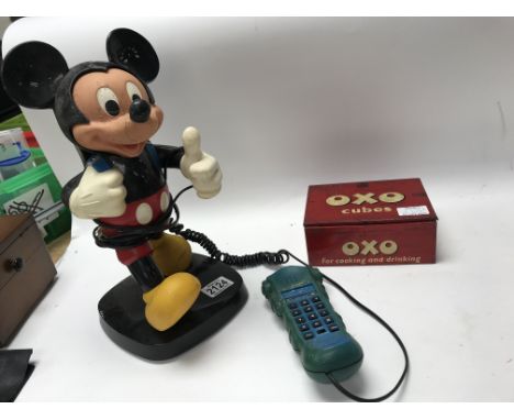 A vintage Micky Mouse figure and toy telephone, and vintage Oxo cube tin. No reserve.