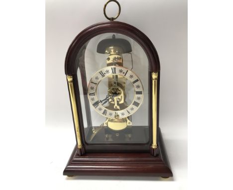 A small open cased mantle clock.