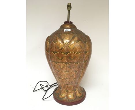 An Indian paper mache lamp decorated with a painted gilt pattern height 55cm.