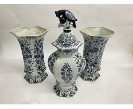 Delftware vases decorated in blue and white with flowers and foliage. Size 36cm approx