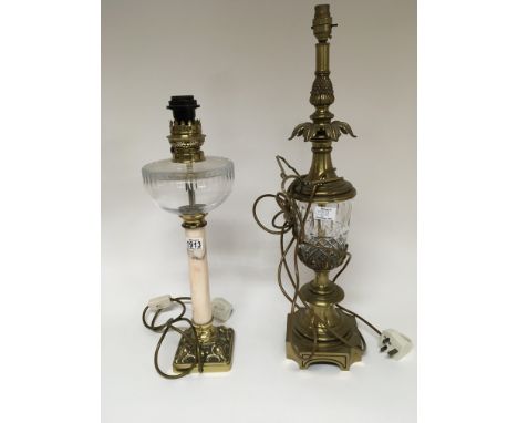 An oil lamp with Carrara marble column on a brass base and one other brass and glass lamp Height 55cm approximately.