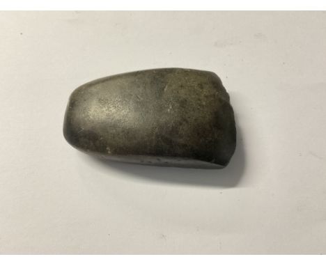 A small Neolithic polished stone are head.