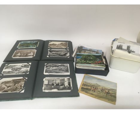 A collection of vintage postcards including two albums and lots of loose cards (a lot) - NO RESERVE