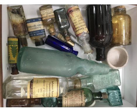A collection of vintage glass bottles and decanters