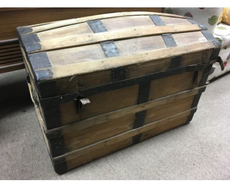 A metal bound domed top pine trunk