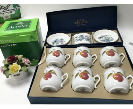 Two Royal Worcester sets in their original boxes, one in the Evesham pattern and the other in the Woodland pattern. Also thre