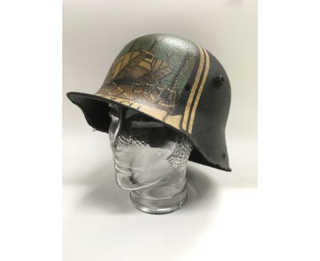 A WW1 German memorial Stahlhelm helmet that was found at Cambrai and painted post war.