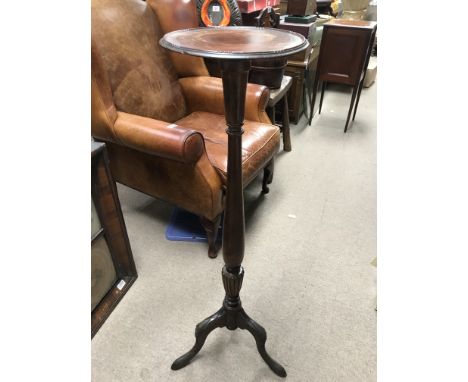 A vintage mahogany torchere