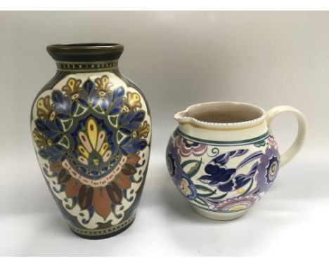 A Poole jug and a Dutch pottery vase.