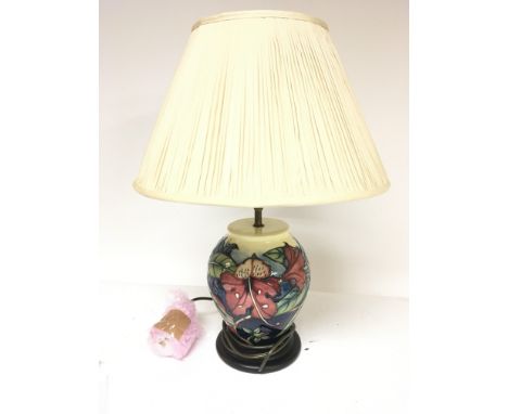 A modern Moorcroft table lamp with shade.