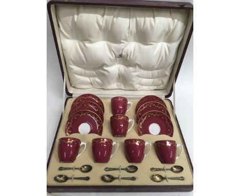 A cased Royal Worcester tea set including cups, saucers and spoons