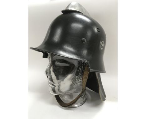 A Third Reich M34 pattern fire helmet with leather nape protector.