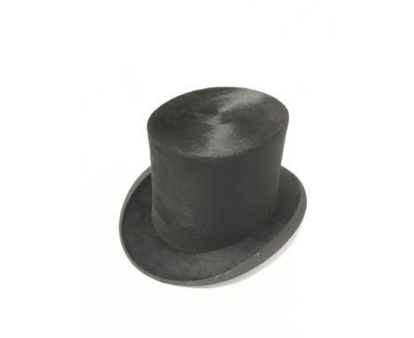 A silk black top hat made by Dunn &amp; Co, Oxford Street. Complete with a vintage good quality leather hat box.