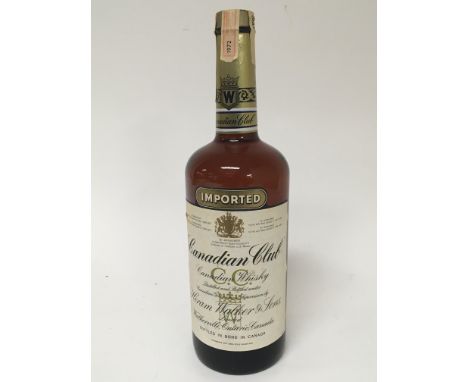 A Vintage bottle of Canadian Club whisky good level. 1 Litre bottle.