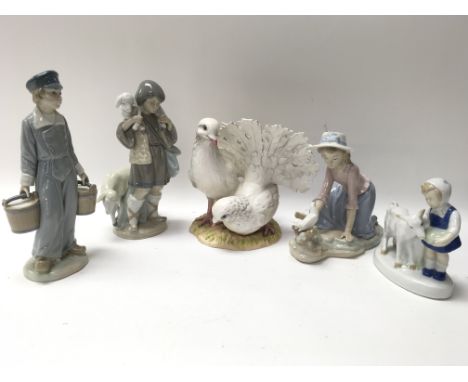 A collection of ceramics including two Lladro figures titled Shepherd Boy and Dutch boy with milk pails, a Nao by Lladro figu