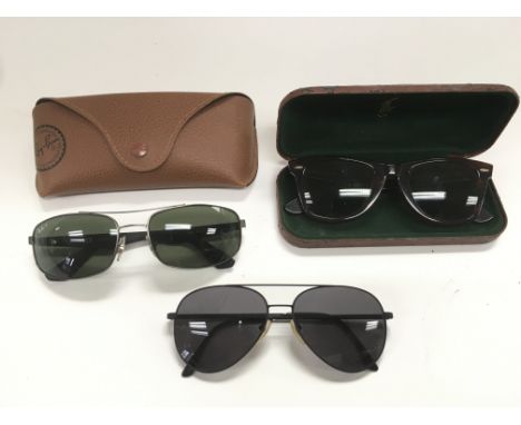 Three pairs of vintage sunglasses.