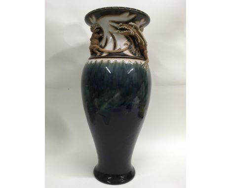 A Royal Doulton vase Designed by Mark Marshall, with raised dragons on a drip glazed body. Size 40cm height. 16cm across. Imp