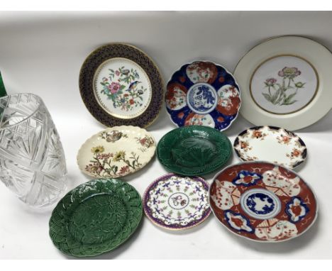 A collection of vintage ceramic plates and cut glass vase.