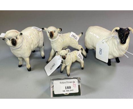 Beswick model of a ram and a Beswick sheep. Together with two ceramic lambs. (4)(B.P. 21% + VAT) 