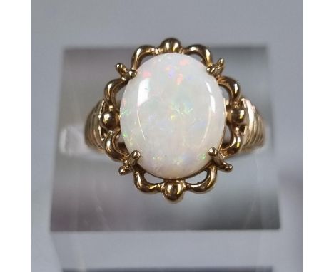 Yellow metal and opal dress ring.  3.9g approx.  Size L.  (B.P. 21% + VAT) 