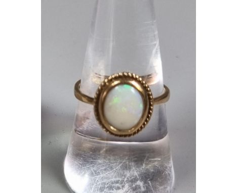 9ct gold opal dress ring. 2.4g approx. Size N. (B.P. 21% + VAT)  Some scratches on opal stone, but ring is complete and secur