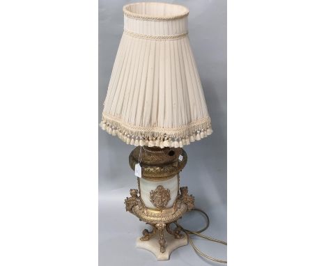 Early 20th century oil lamp base now converted to electricity, having alabaster body and base, with gilt metal winged figural
