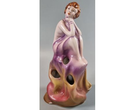 Royal Staffordshire pottery, Wilkinson Ltd, England, a seated Art Deco figure in pensive pose, possibly a spill vase or hatpi