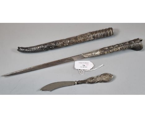 White metal relief cast and chased Khandjar dagger of Middle Eastern origins, with steel blade. Overall 36cm long approx. Tog