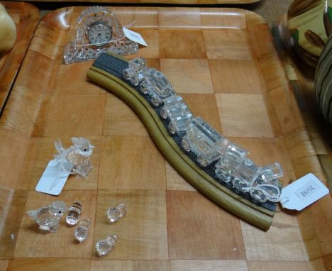 Tray of glassware to include: a Waterford crystal clock, a Swarovski crystal train on wooden track and crystal hen, cockerel 