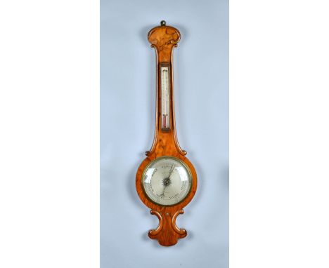 A Victorian walnut wheel barometer with 8in silvered dial signed 'W. H. YOUNG BOSTON' 95cm high.  Condition Report The barome