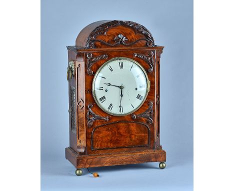 An early Victorian mahogany three train quarter striking bracket clockThe arched case with canted angles, with carved foliate