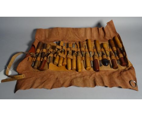 A quantity of early 20th century carpenters tools within a leather case.  Condition Report In used condition. 