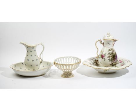 An Amstel porcelain jug and oval basin, circa 1800, painted with blue cornflowers inside gilt rims, blue painted Amstel mark,