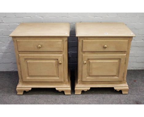 A pair of grey/green painted bedside tables with single drawer over cupboard on ogee bracket feet, 58cm wide x 71cm high. 