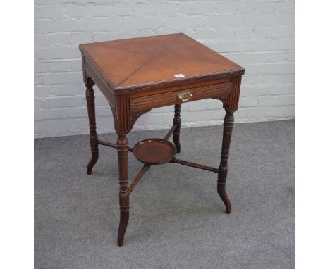 An Edwardian walnut envelope top card table, stamped 'Edwards & Roberts' with frieze drawer, on ring turned splayed legs unit