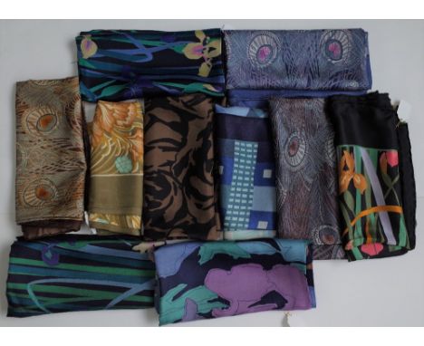 A collection of ten Liberty of London printed silk scarves, including one printed with Irises and butterflies to a black grou
