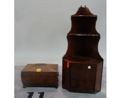 A Regency mahogany sarcophagus shaped tea caddy, 31cm wide x 20cm high, together with a small mahogany corner cupboard, 32cm 