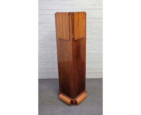 An Art Deco walnut plinth of stepped square form, on split turned base, 40cm wide x 135cm high. Condition Report Top with ven