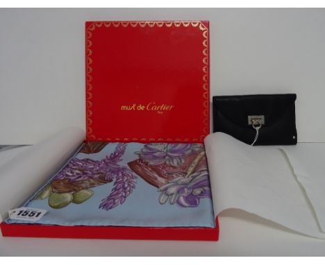 An Hermes printed silk scarf 'Jardin Secret' designed by Valerie Dawlat-Dumoulin, circa 2003 contained within a Must de Carti
