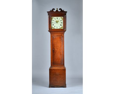 An oak 30 hour longcase clockBy Triggs & Busby, GuildfordEarly 19th CenturyThe hood with swan-neck pediment, with column upri