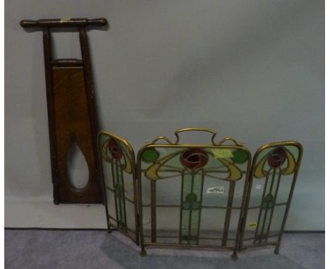 A 19th century brass and glass Art Nouveau style fire screen, 76cm high x 40cm wide and an oak boot pull. 