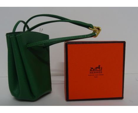 A Hermes green grained leather Vespa pouch, with gathered concertina sides and drawstring leather chord closure and wrist str