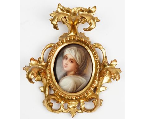 A small German oval porcelain plaque, late 19th century, painted with a portrait of Beatrice Cenci after Guido Reni, indistin