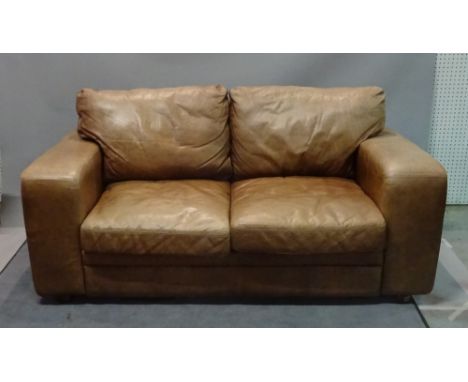 A modern brown leather two seat sofa on block supports, 183cm wide x 95cm deep.