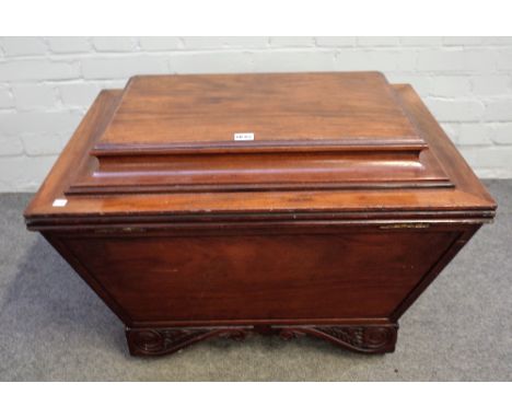 A late Regency mahogany sarcophagus shaped cellarette on carved bracket feet, 72cm wide x 52cm high.