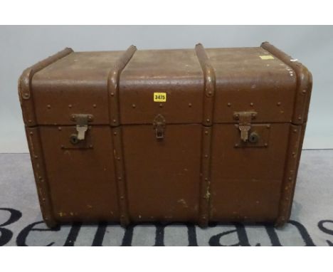 An early 20th century canvas and wood bound travelling trunk, 76cm wide x 52cm high. 